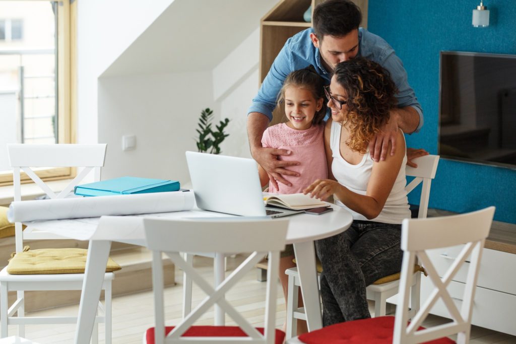 Mom looks at a budget to decide whether to rent or buy a house