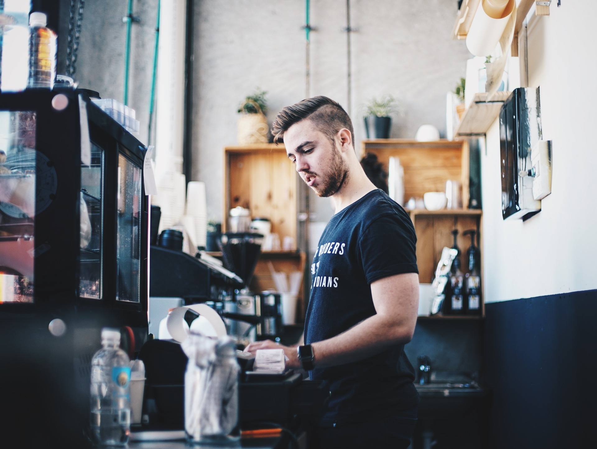 Man working behind a counter