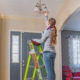 Woman on ladder with light