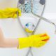 A woman cleaning bath at home