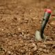 Gardening spade in dirt