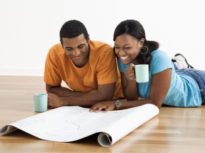Couple looking at remodeling blueprints