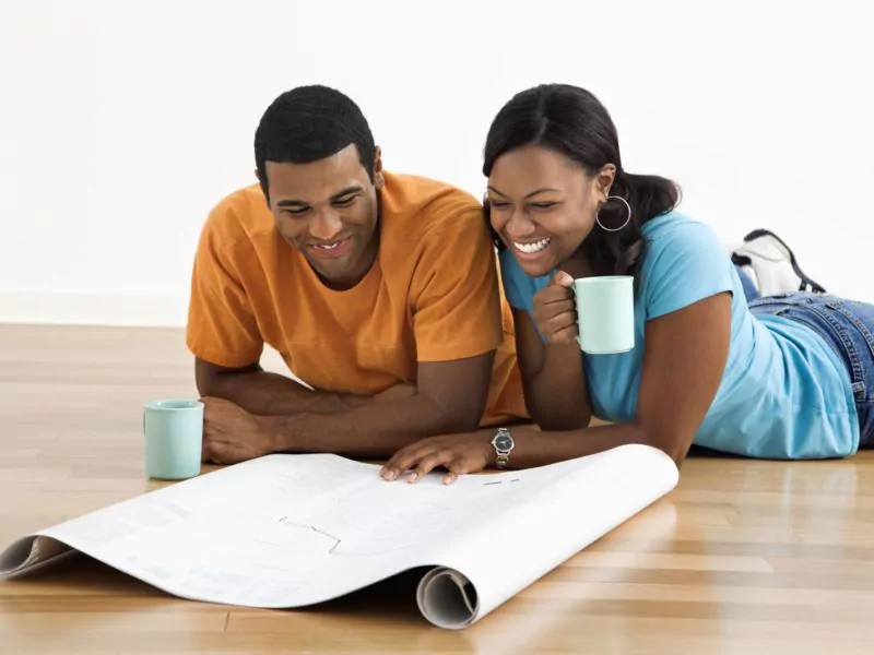 Couple looking at remodeling blueprints