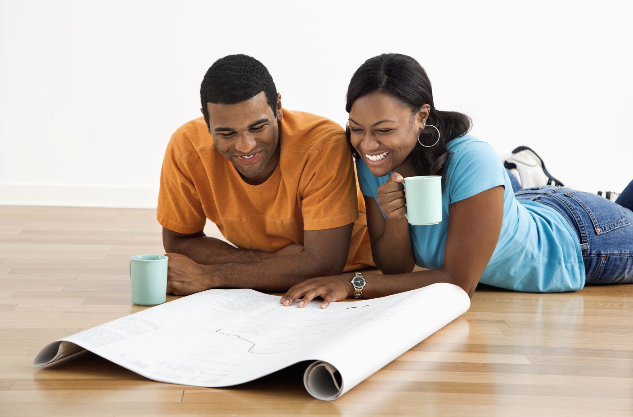 Couple looking at remodeling blueprints