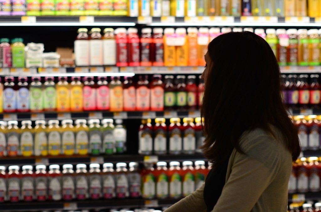 Woman shopping for food in grocery store