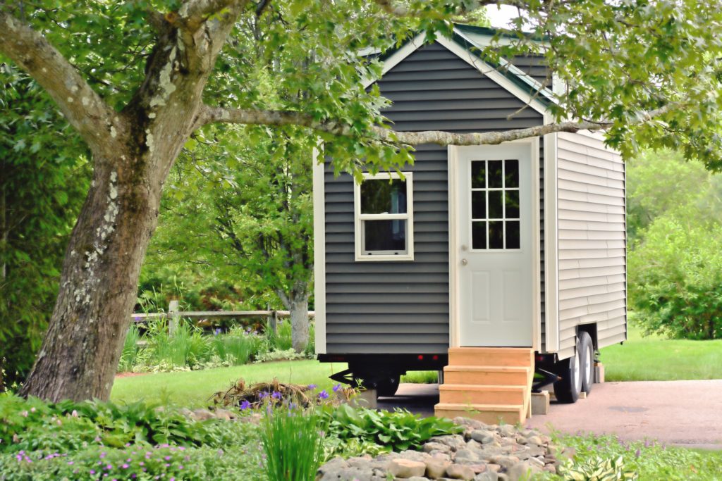 Tiny gray house on wheels