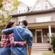 Couple admiring a new home