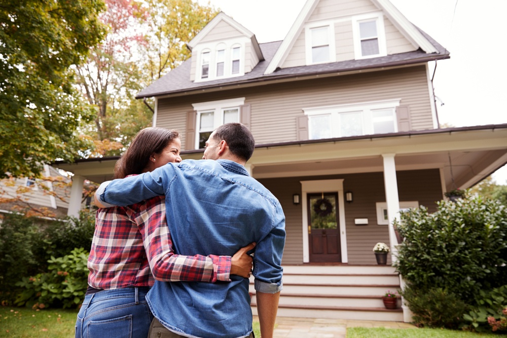 Couple admiring a new home