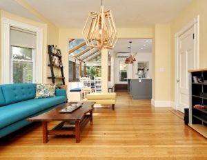 Den with hardwood floor