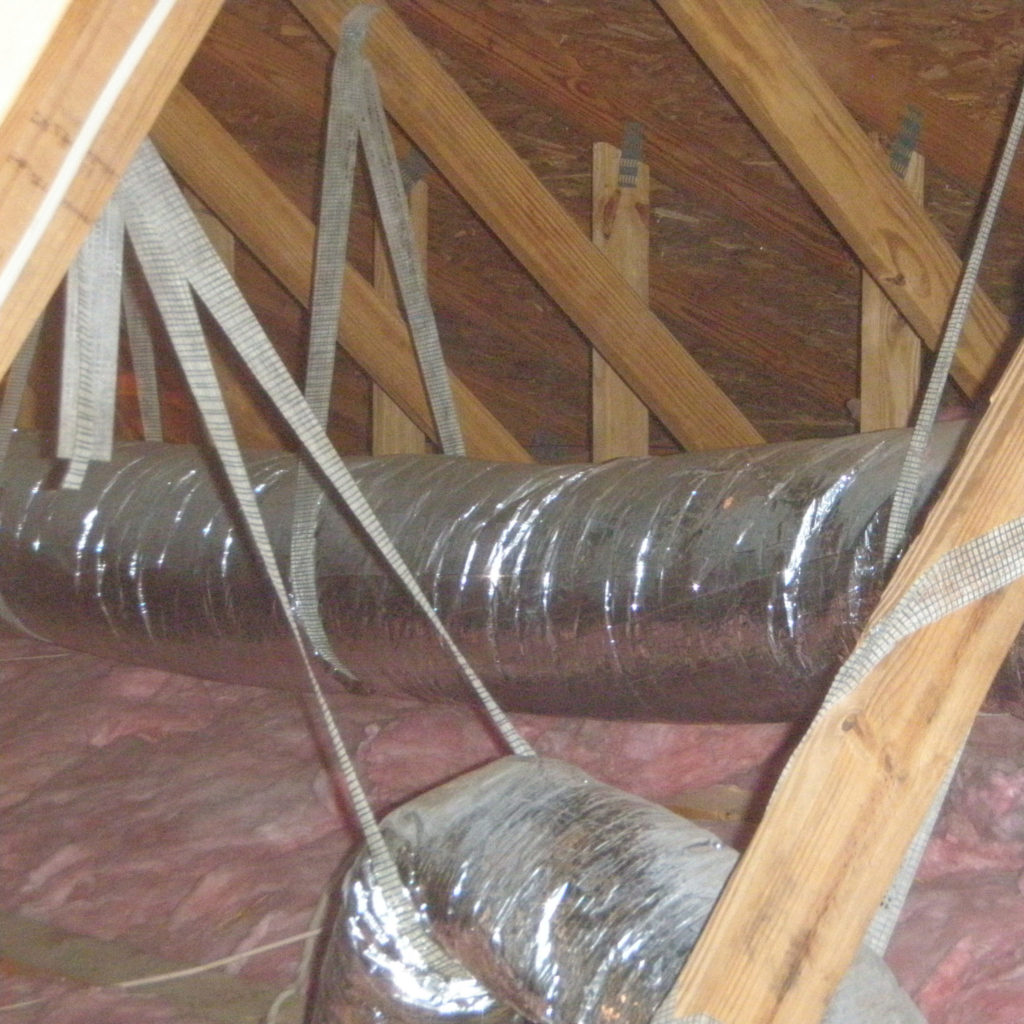Heating and cooling ducts run through an attic
