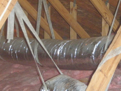 Heating and cooling ducts run through an attic