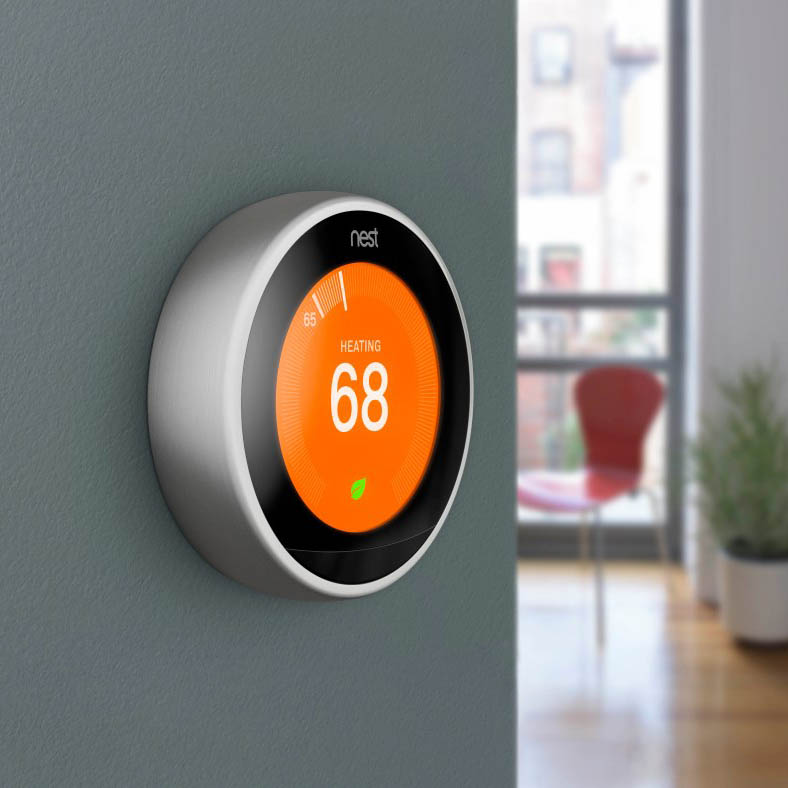 Nest thermostat on grey wall