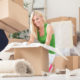 Man and woman packing boxes to move
