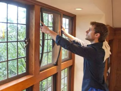 Man installing Indow Window insert