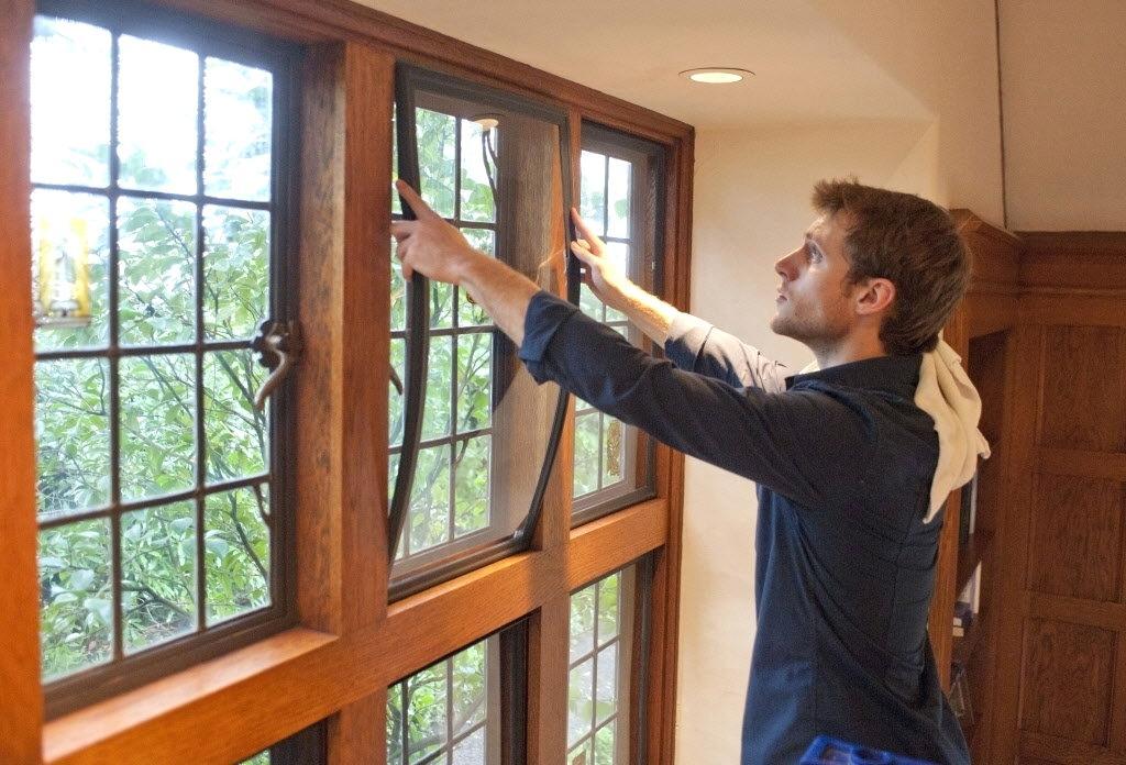 Man installing Indow Window insert