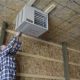 Man installing garage heater