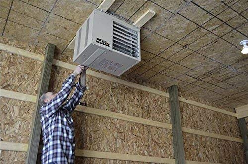 Man installing garage heater