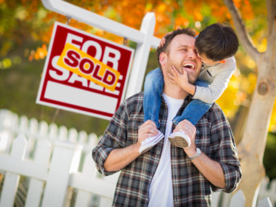 Home on the market with sold sign