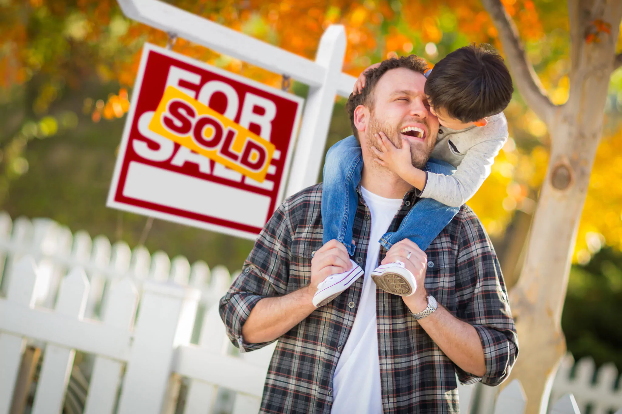 Home on the market with sold sign
