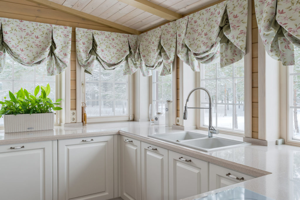 White kitchen windows with swag curtains are an easy add on to your kitchen remodeling project.