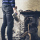 Woman destroying wall with sledgehammer