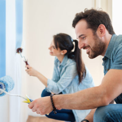 Renovation diy paint couple in new home painting wall together