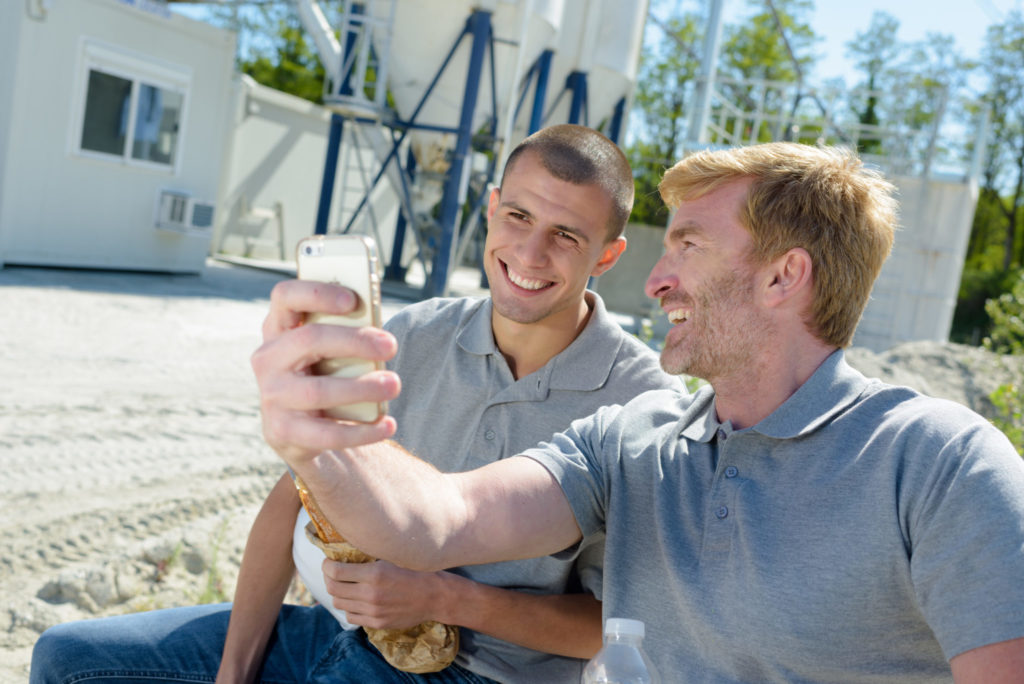 Workers looking at a mobile home.