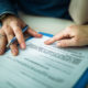 Close up of signing a mortgage contract