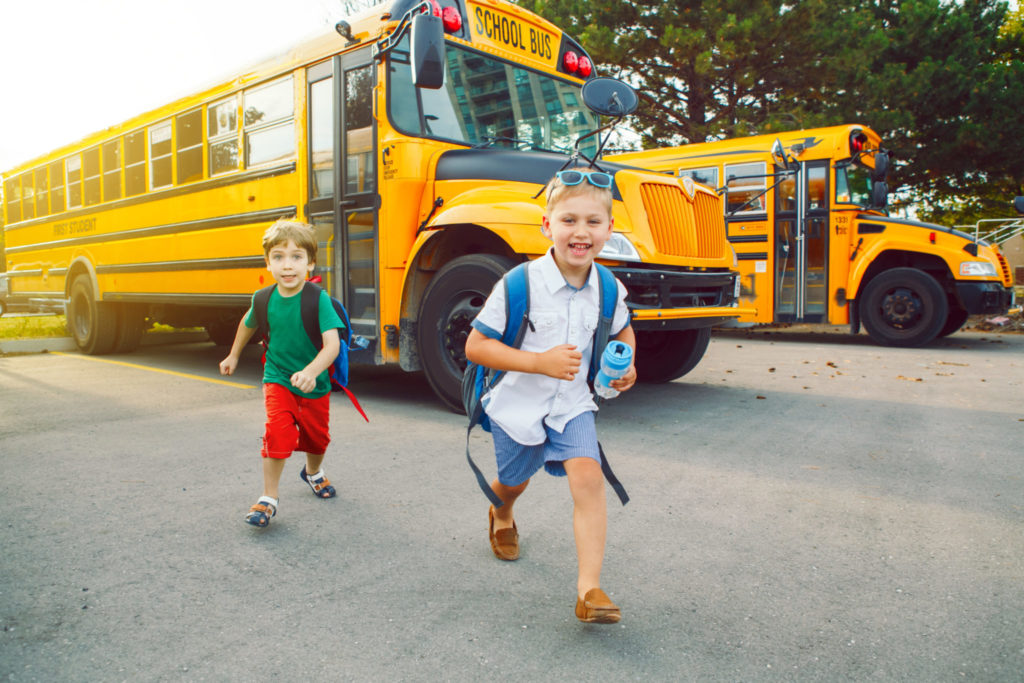 Two funny happy kids running home