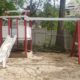 Plastic swing set on sandy soil