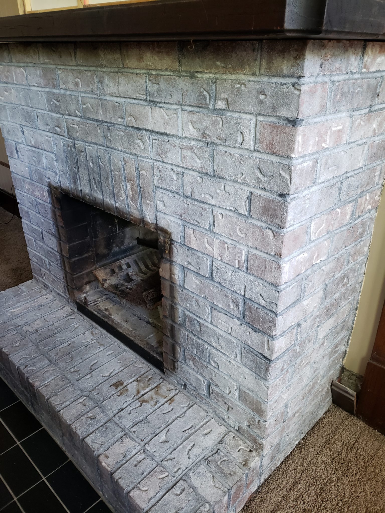 Brick fireplace with smoke stains