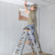 Man installing basement ceiling.