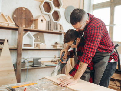 Father and son working together in a workshop