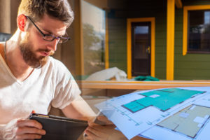 Man reviews plans for a new home build