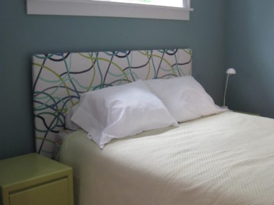 Upolstered headboard in bedroom