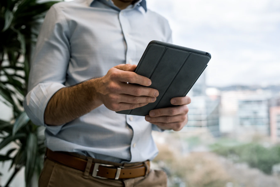 Man viewing virtual real estate tour on a tablet