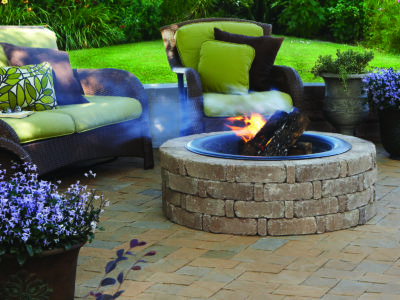 Brick fire pit in a paver patio