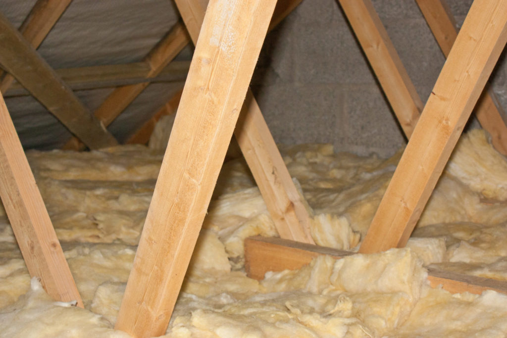 Attic truss and fiberglass insulation.