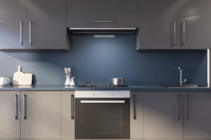Blue kitchen with gray countertops