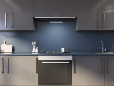 Blue kitchen with gray countertops