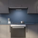 Blue kitchen with gray countertops