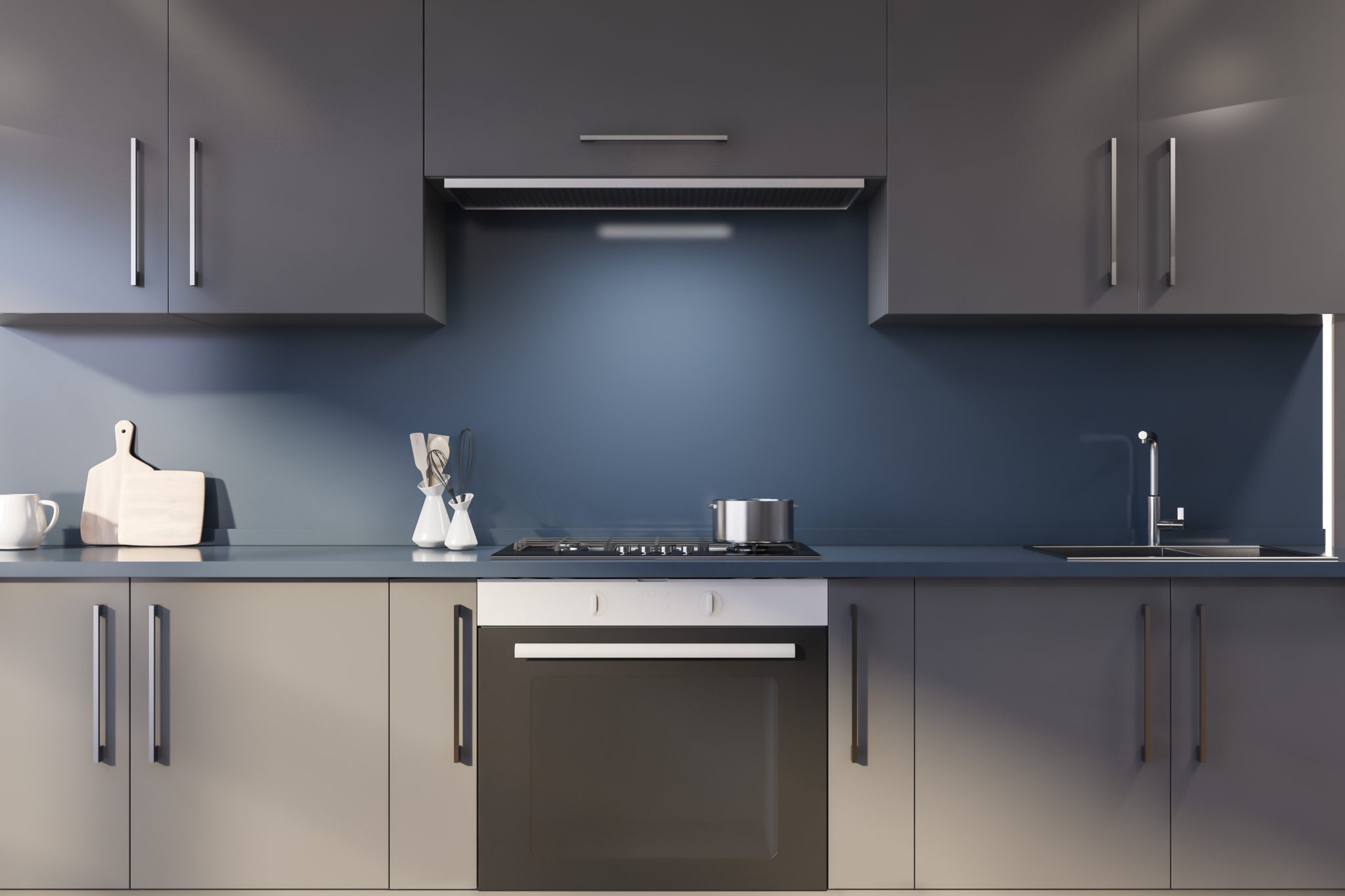 Blue kitchen with gray countertops