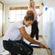 Women painting walls in a new home