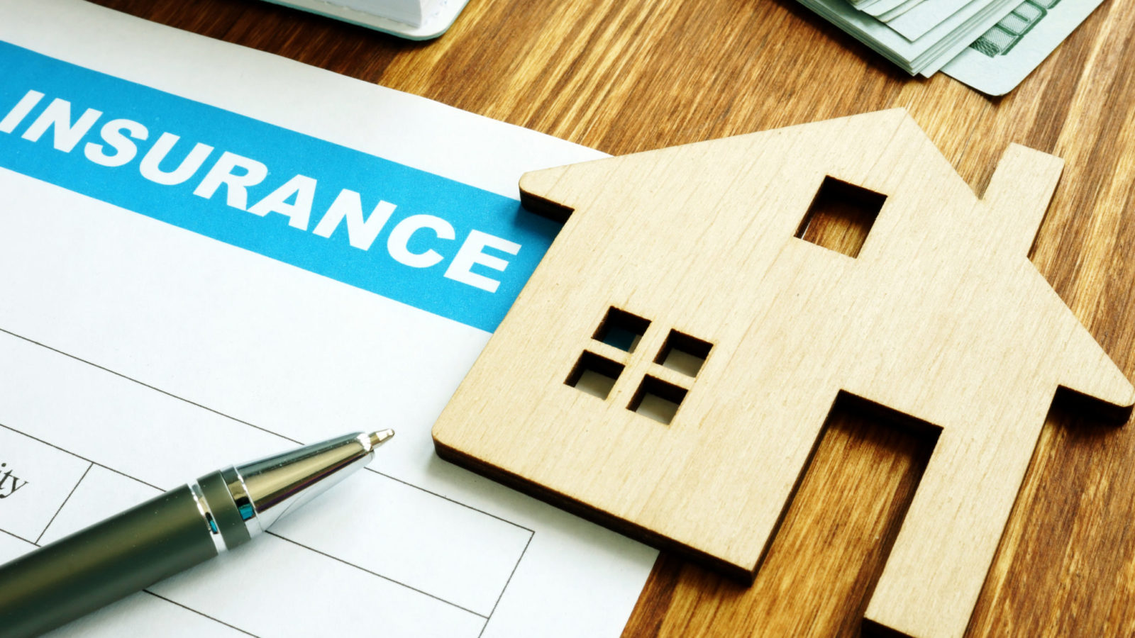 House insurance form for homeowners and model of home.