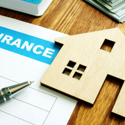 House insurance form for homeowners and model of home.