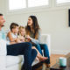 Family sitting in a new remodeled basement