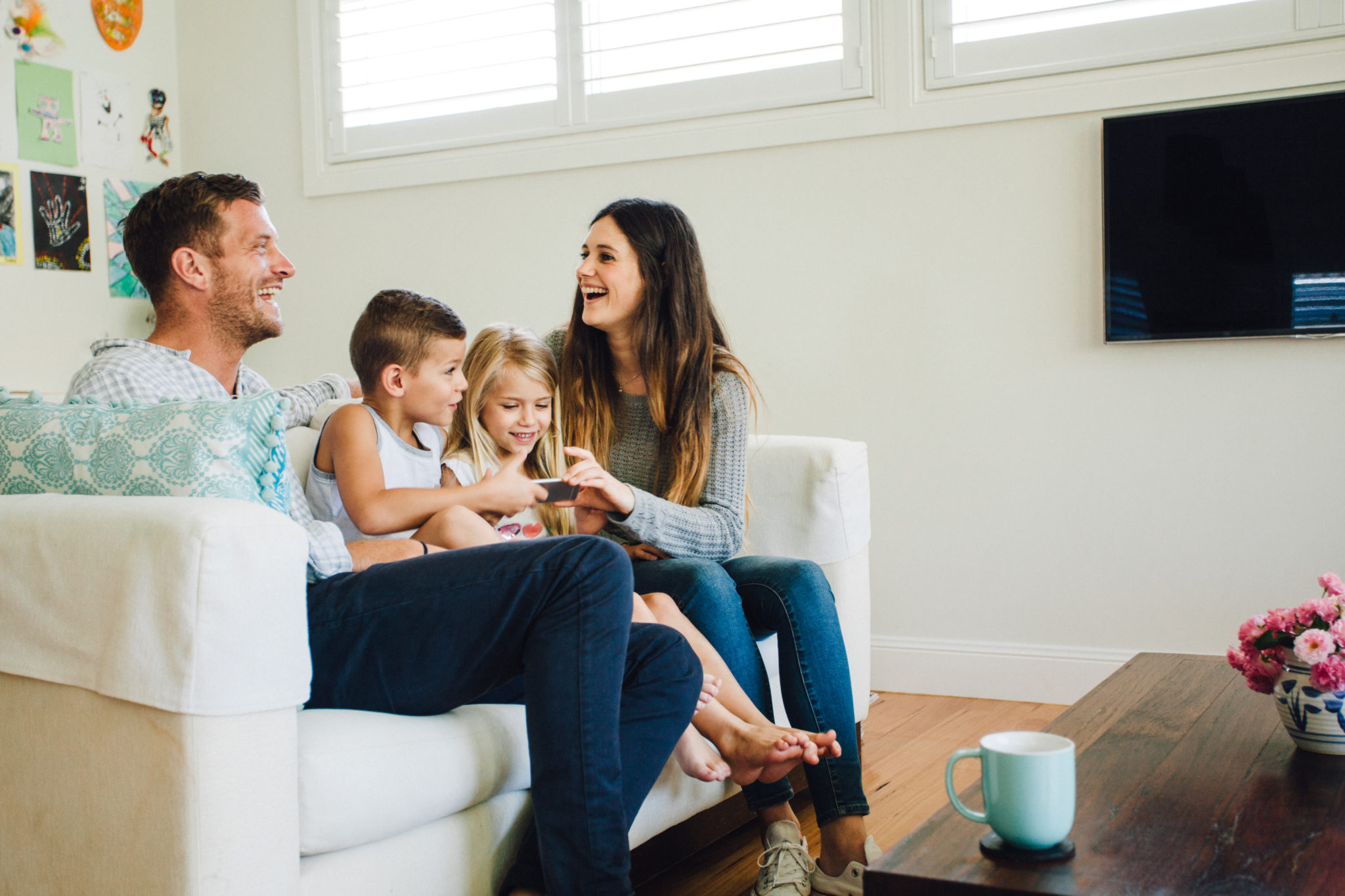 Family sitting in a new remodeled basement