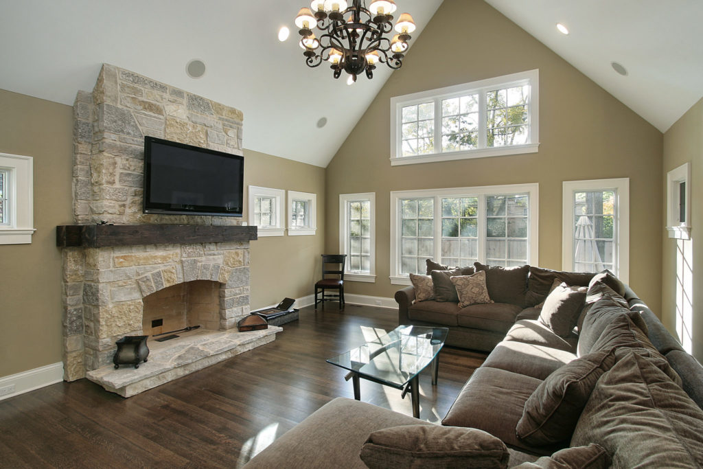 Family room in luxury home with stone fireplace
