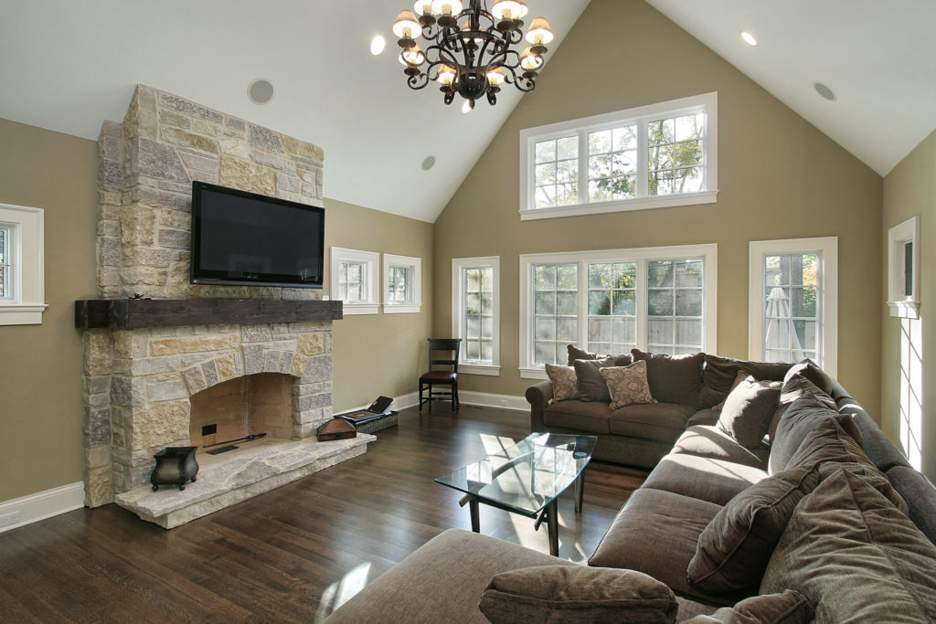 Family room in luxury home with stone fireplace