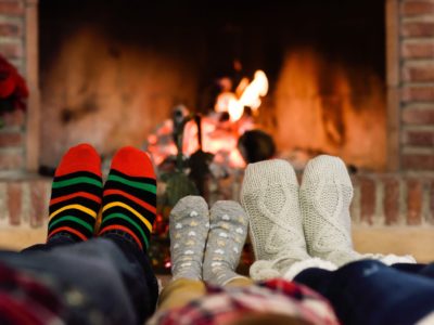 Family in front of a fireplace